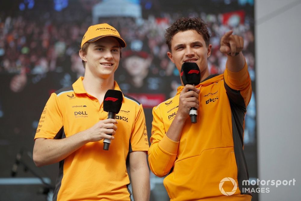 Oscar Piastri, McLaren, Lando Norris, McLaren, on stage in the Fanzone